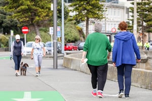 People walking on pavement