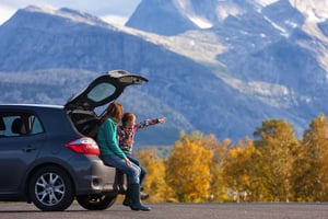 Mother and Daughter sightseeing beside their car